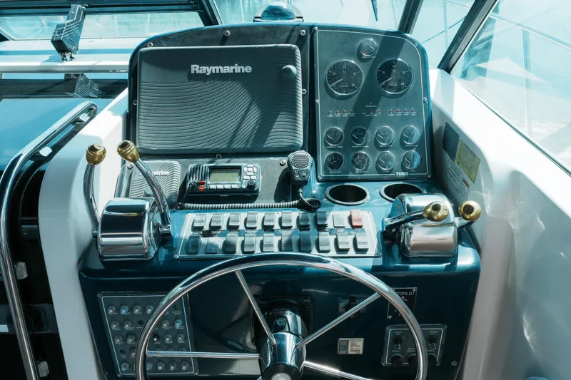 Slide: The Image of Control panel of a 1999 Tiara Yachts 3500 Open with Raymarine equipment. - 7
