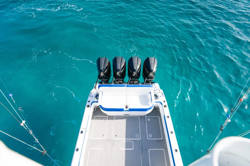 Slide: The Image of 2022 Nor-Tech 392 Super Fish boat with four engines on turquoise water. - 28