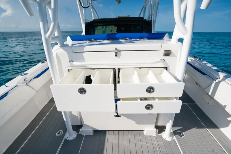 Slide: The Image of 2022 Nor-Tech 392 Super Fish boat with open storage drawers on deck. - 31