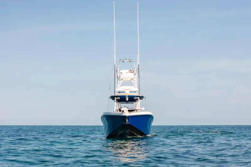 Slide: The Image of 2022 Nor-Tech 392 Super Fish boat on open water, front view. - 40