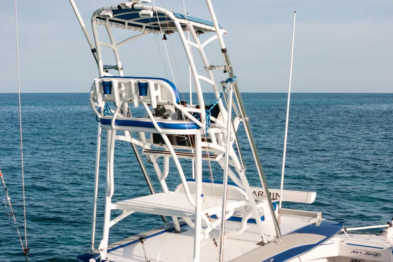Slide: The Image of 2022 Nor-Tech 392 Super Fish boat with tower, on calm ocean waters. - 42