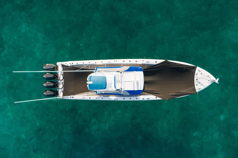 Slide: The Image of Aerial view of 2022 Nor-Tech 392 Super Fish boat on clear turquoise water. - 5