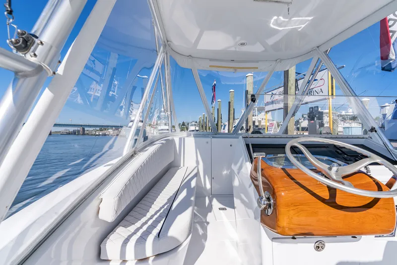 Slide: The Image of Interior view of a 2005 L&H Walkaround boat at the marina. - 28
