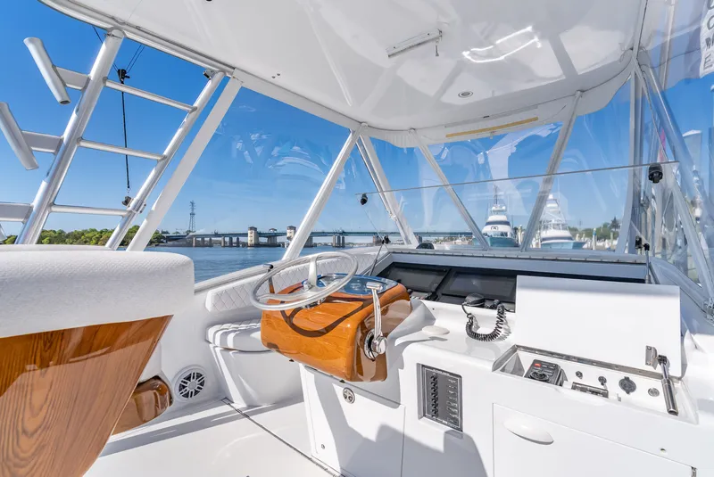 Slide: The Image of Interior view of a 2005 L&H Walkaround boat with helm station. - 29