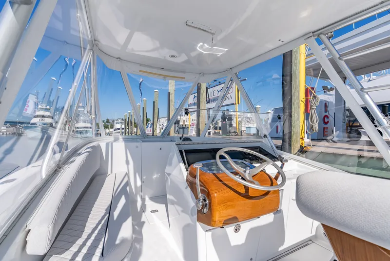 Slide: The Image of Interior of a 2005 L&H Walkaround boat at the marina. - 31