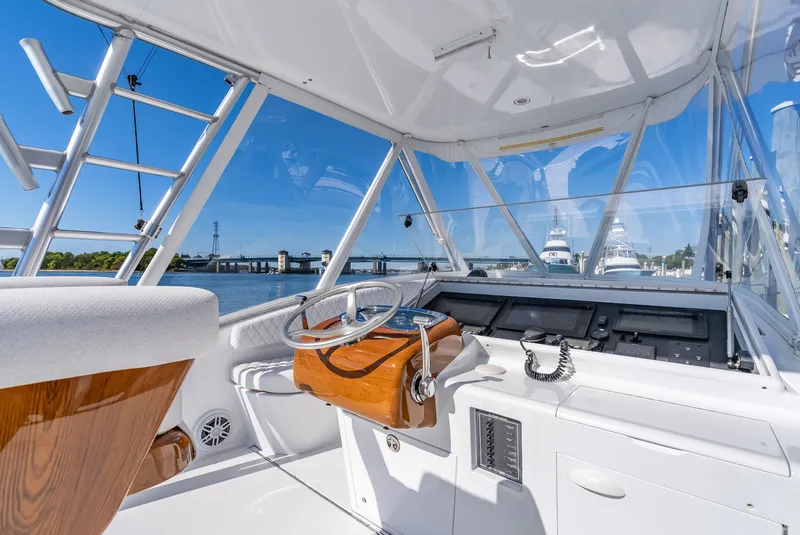 Slide: The Image of Interior view of a 2005 L&H Walkaround boat with helm station. - 32
