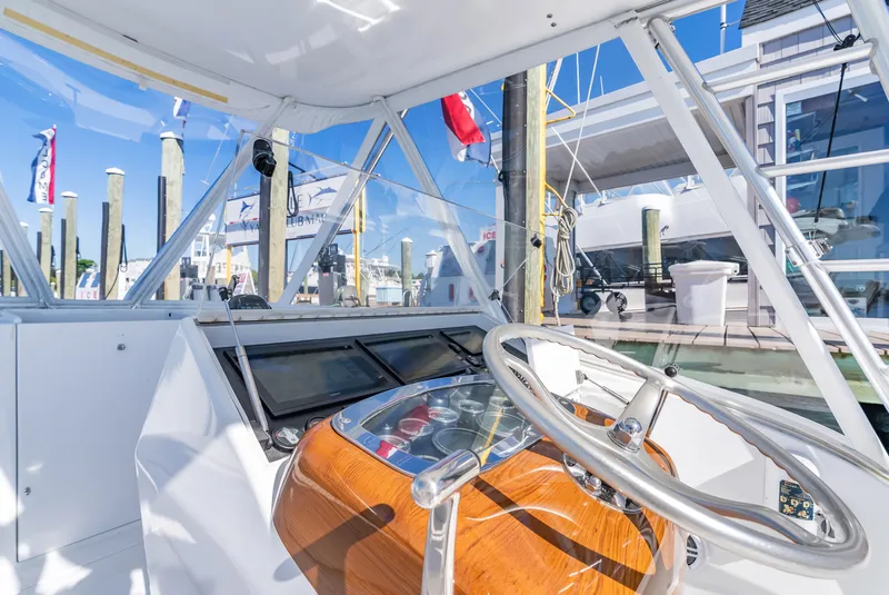 Slide: The Image of Interior view of a 2005 L&H Walkaround boat at the dock. - 33