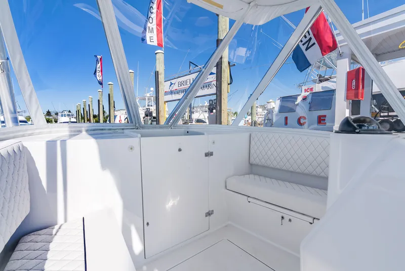 Slide: The Image of Interior of a 2005 L&H Walkaround boat at the marina. - 37