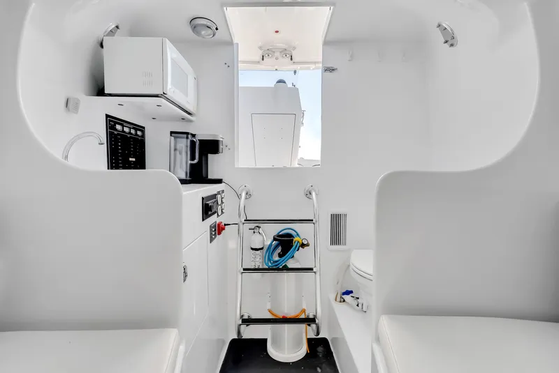Slide: The Image of Interior of a 2005 L&H Walkaround boat with microwave and toilet. - 39