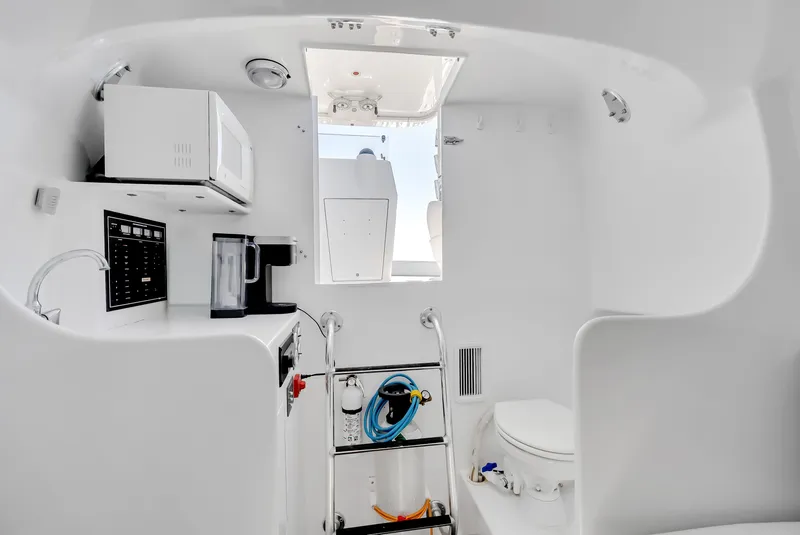 Slide: The Image of Interior of a 2005 L&H Walkaround yacht with kitchenette and toilet. - 40