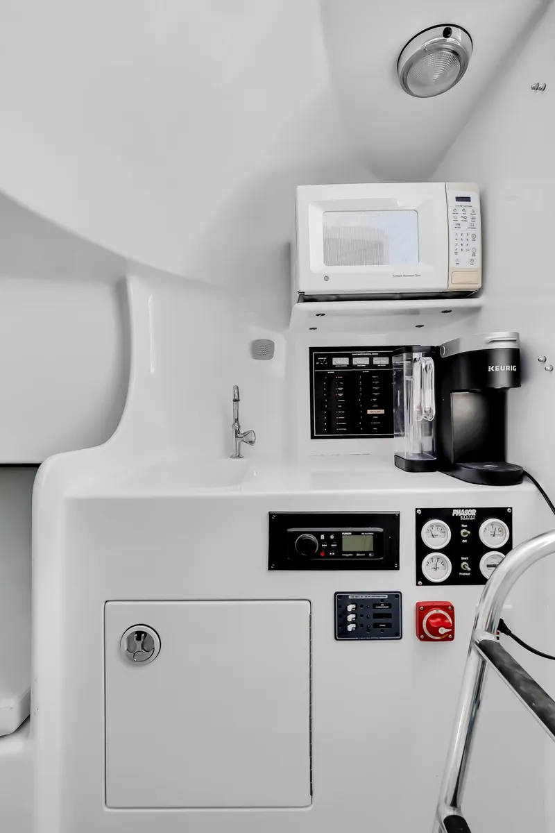 Slide: The Image of Interior of a 2005 L&H Walkaround with microwave and coffee maker. - 45