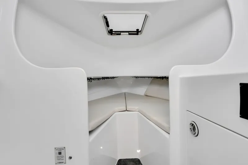 Slide: The Image of Interior of a 2005 L&H Walkaround boat, white upholstery. - 47
