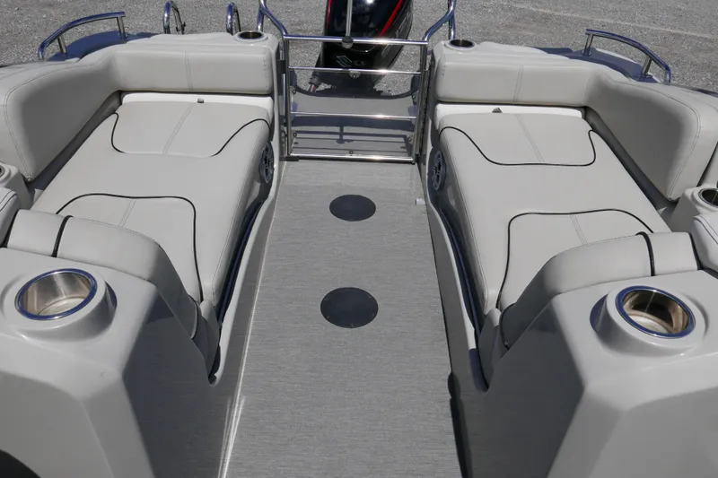 Slide: The Image of 2018 Sylvan S-3 boat interior with gray seating and cup holders. - 12