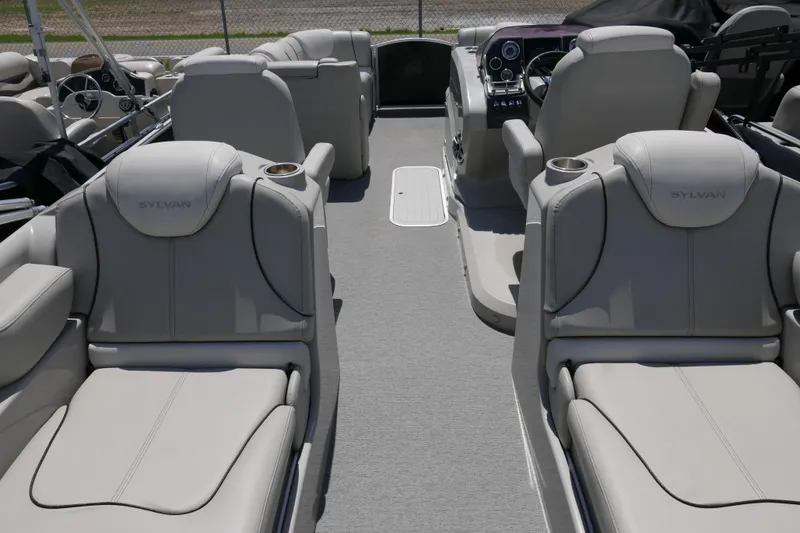 Slide: The Image of Luxurious 2018 Sylvan S-3 boat interior with plush seating and modern dashboard. - 13