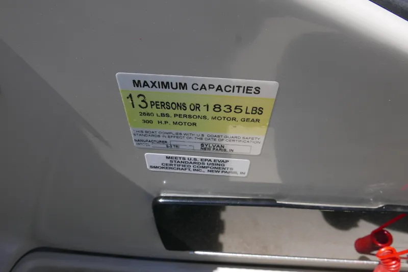 Slide: The Image of Maximum capacity label on 2018 Sylvan S-3 boat, 13 persons or 1835 lbs. - 14