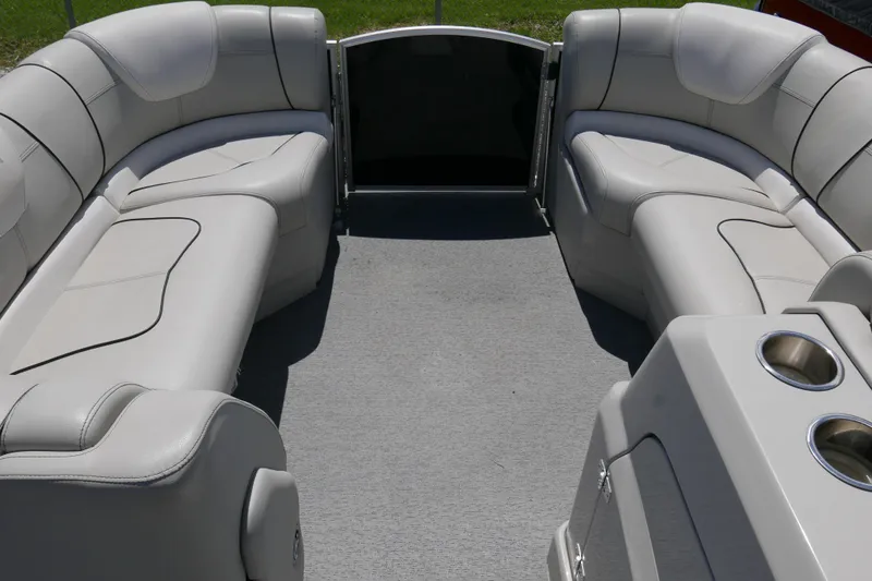 Slide: The Image of Interior of 2018 Sylvan S-3 pontoon boat with plush seating and cup holders. - 6