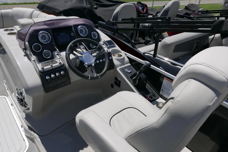 Slide: The Image of Cockpit of 2018 Sylvan S-3 boat with modern controls and comfortable seating. - 8