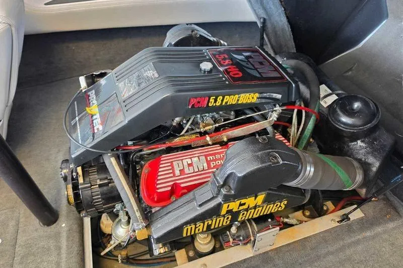 Slide: The Image of 1995 Correct Craft Ski Nautique PCM 5.8 Pro Boss engine in boat interior. - 3