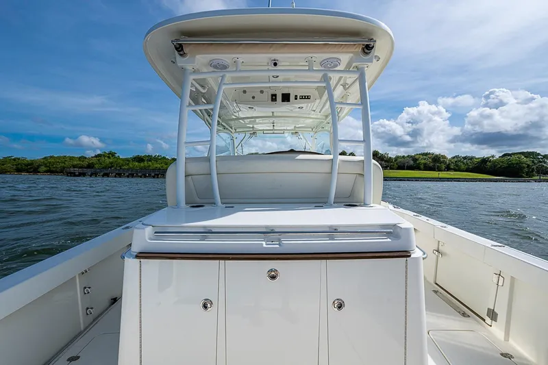 Slide: The Image of 2019 Hinckley Sport Boat 40 C on water, showcasing sleek design and spacious deck. - 10