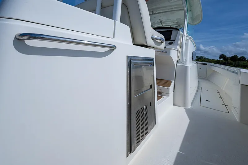 Slide: The Image of 2019 Hinckley Sport Boat 40 C deck view with seating and storage. - 14