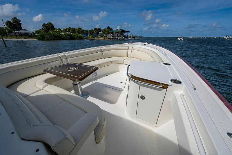 Slide: The Image of Luxurious 2019 Hinckley Sport Boat 40 C with elegant seating and scenic water view. - 15