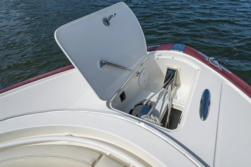 Slide: The Image of Hinckley Sport Boat 40 C 2019 anchor compartment open on calm water. - 17