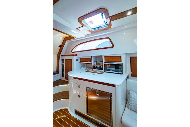 Slide: The Image of Luxurious interior of 2019 Hinckley Sport Boat 40 C with modern kitchen amenities. - 20