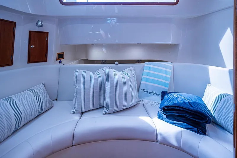 Slide: The Image of Luxurious interior of 2019 Hinckley Sport Boat 40 C with plush seating and cushions. - 23