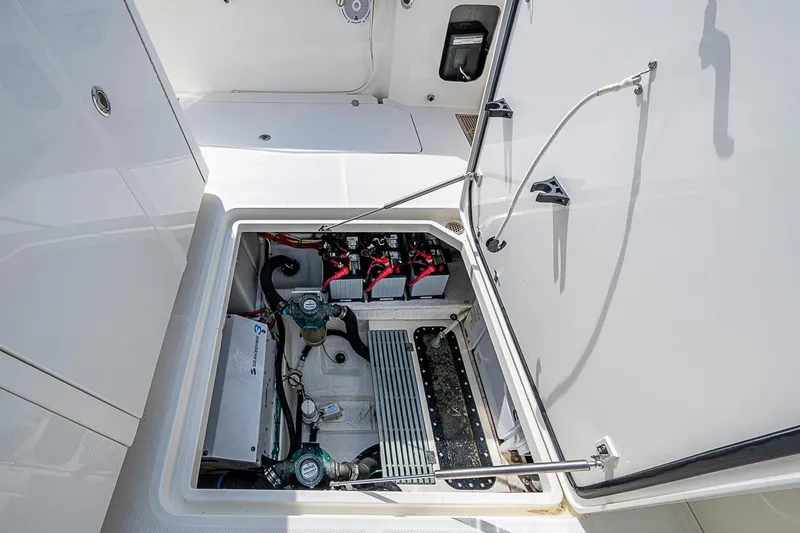 Slide: The Image of Engine compartment of 2019 Hinckley Sport Boat 40 C, showcasing mechanical components and wiring. - 27