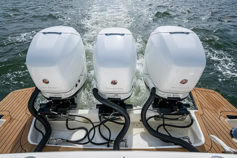 Slide: The Image of Triple outboard engines on a 2019 Hinckley Sport Boat 40 C, cruising on open water. - 29
