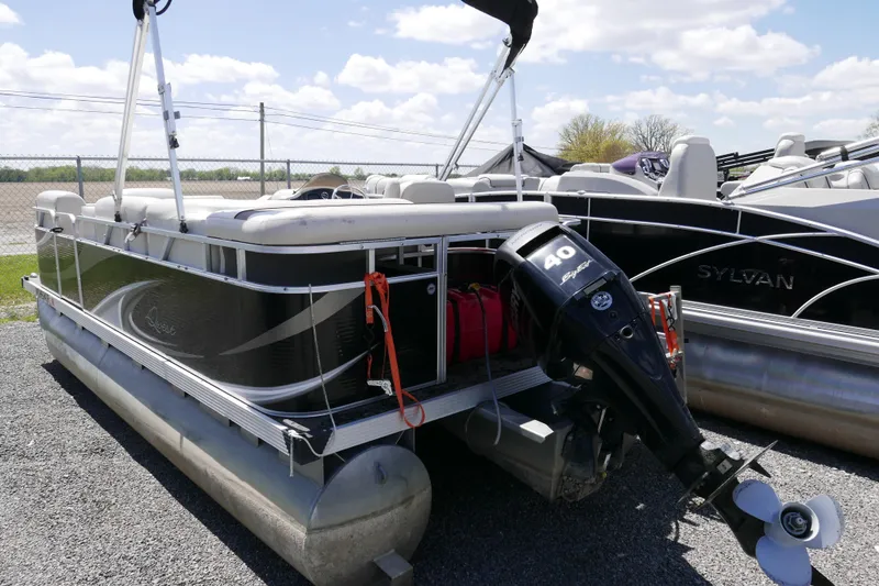Slide: The Image of 2011 Apex Marine Qwest Adventure 16 pontoon boat with 40 HP outboard motor. - 3
