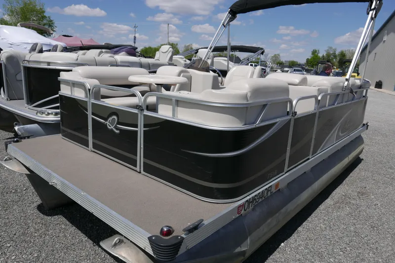 The Image of 2011 Apex Marine Qwest Adventure 16 pontoon boat with seating, parked outdoors. - 0