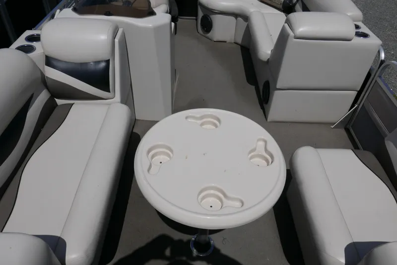 Slide: The Image of Interior of 2011 Apex Marine Qwest Adventure 16 pontoon boat with seating and table. - 5