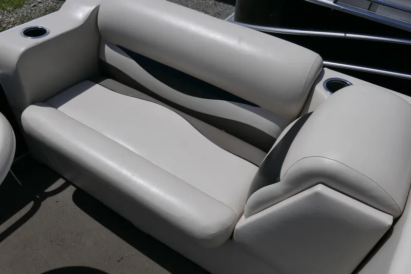 Slide: The Image of 2011 Apex Marine Qwest Adventure 16 boat seating with cup holders. - 6