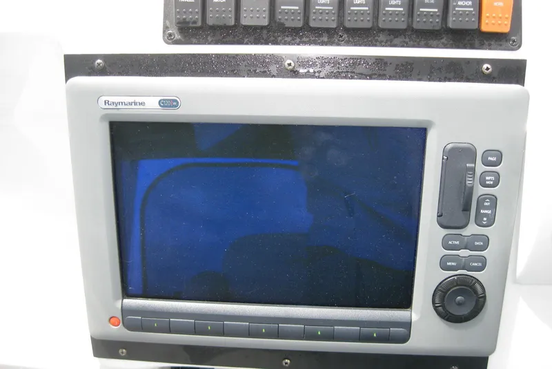 Slide: The Image of Raymarine C120W marine display on 2010 Crownline 330 CR boat dashboard. - 23