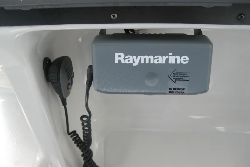 Slide: The Image of Raymarine equipment on 2010 Crownline 330 CR boat, featuring a microphone and sun cover. - 25