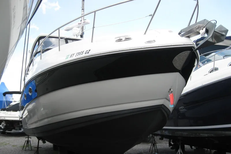 Slide: The Image of 2010 Crownline 330 CR boat on display, showcasing sleek design and modern features. - 3