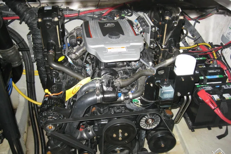 Slide: The Image of Engine compartment of a 2010 Crownline 330 CR boat, showcasing detailed mechanical components. - 41