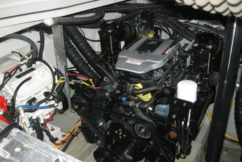 Slide: The Image of Engine compartment of a 2010 Crownline 330 CR boat, showcasing detailed mechanical components. - 42