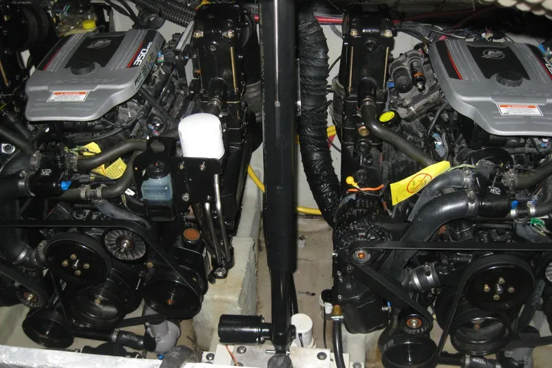 Slide: The Image of Engine compartment of a 2010 Crownline 330 CR boat, showcasing dual engines. - 43