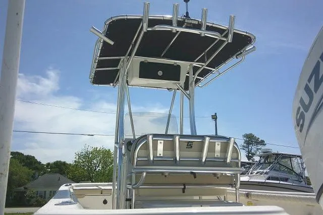 Slide: The Image of 2021 Carolina Skiff 23 LS boat with T-top and rod holders, viewed from the rear. - 10