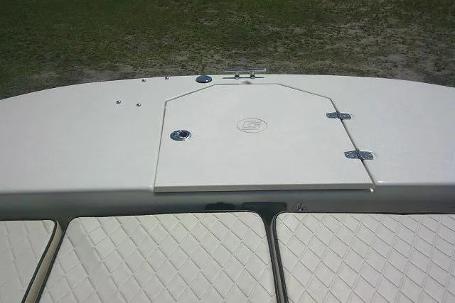Slide: The Image of 2021 Carolina Skiff 23 LS boat deck with storage hatch and cushioned seating. - 12