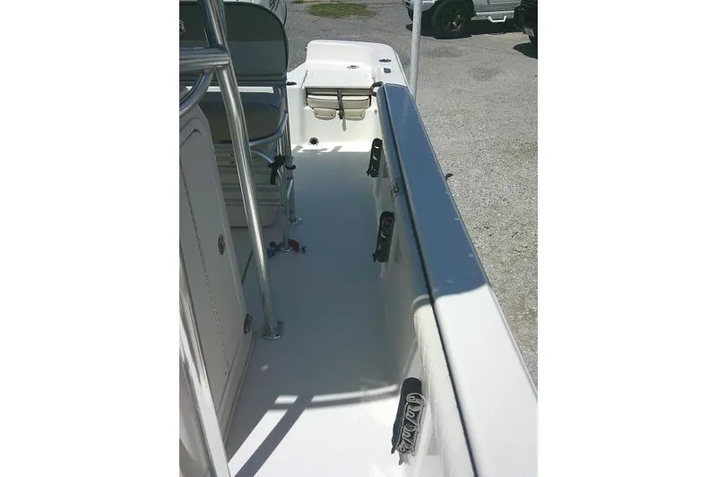 Slide: The Image of 2021 Carolina Skiff 23 LS boat interior with seating and rod holders. - 16