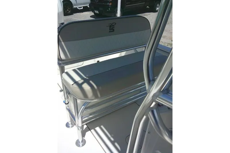 Slide: The Image of 2021 Carolina Skiff 23 LS boat seating with sleek metal frame and cushioned backrest. - 18