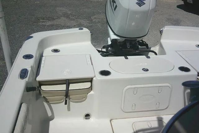 Slide: The Image of 2021 Carolina Skiff 23 LS boat interior with Suzuki outboard motor. - 19