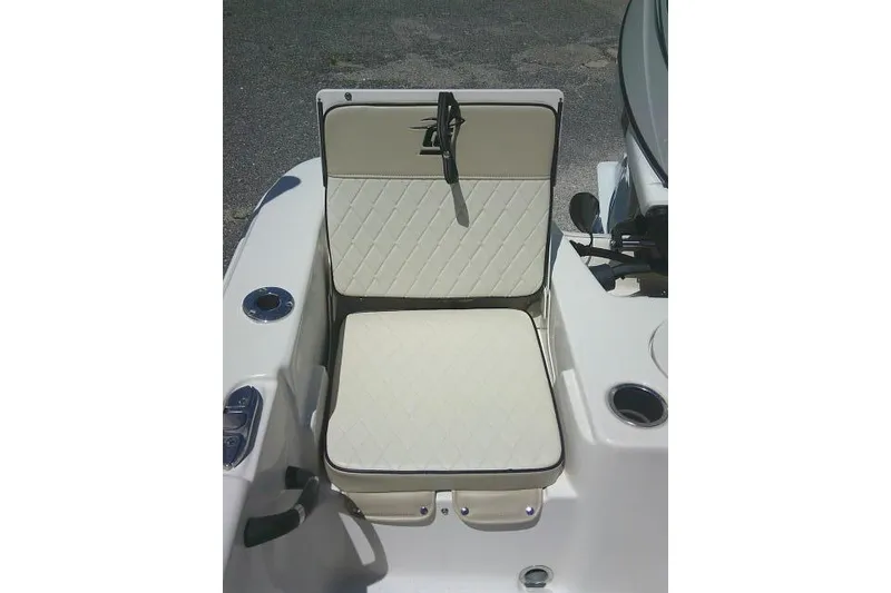Slide: The Image of 2021 Carolina Skiff 23 LS boat seat with diamond-pattern upholstery and cup holder. - 21