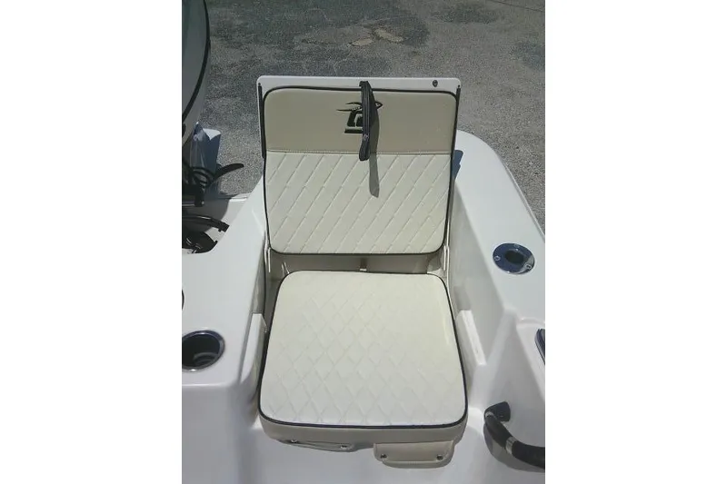 Slide: The Image of 2021 Carolina Skiff 23 LS boat seat with diamond-pattern upholstery and cup holders. - 24