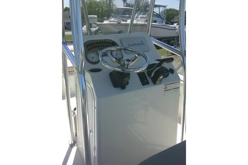 Slide: The Image of 2021 Carolina Skiff 23 LS boat console with Garmin navigation system and steering wheel. - 28
