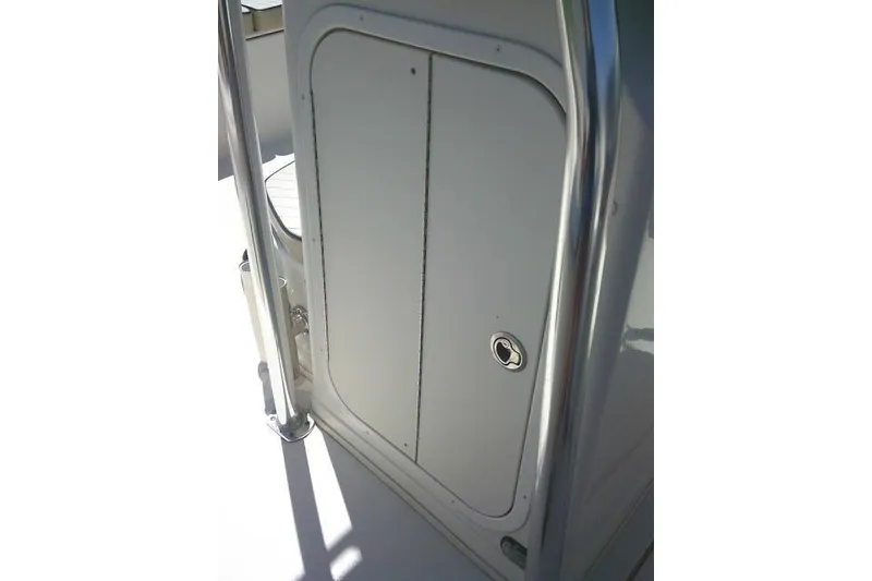 Slide: The Image of 2021 Carolina Skiff 23 LS boat storage compartment with stainless steel railing. - 29