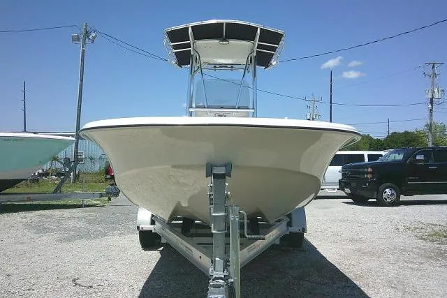 Slide: The Image of 2021 Carolina Skiff 23 LS boat on trailer, parked outdoors under clear sky. - 3
